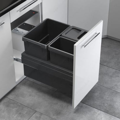 Recycling center with two to four synchronized bins